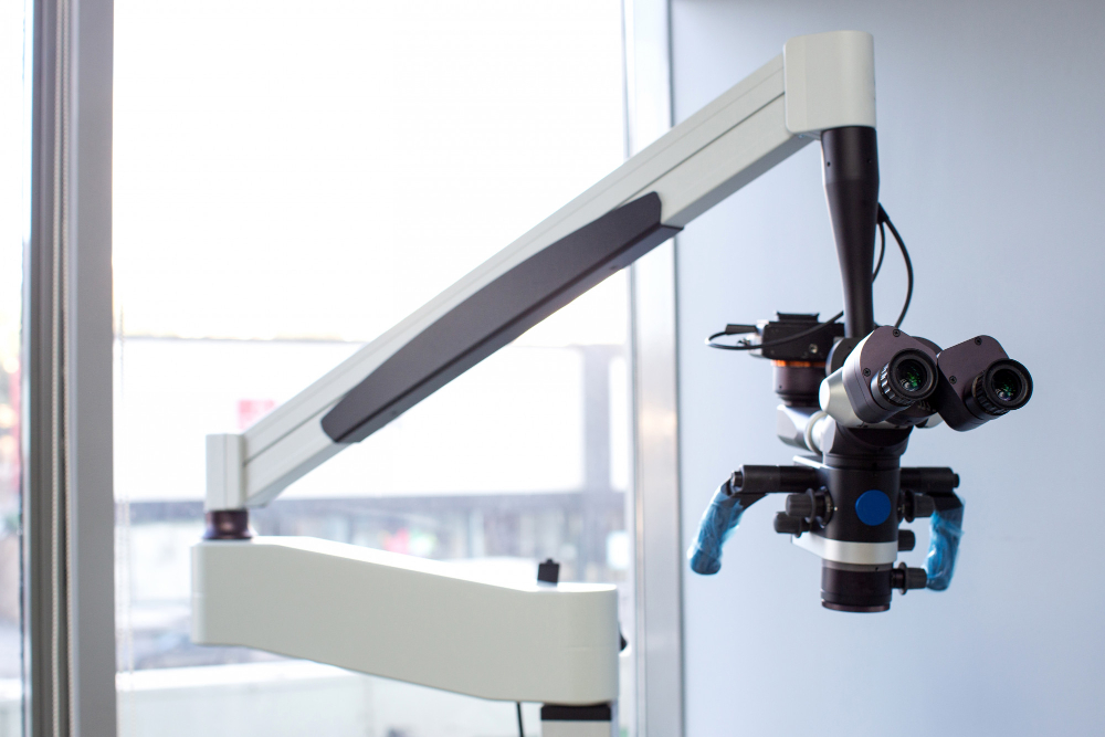 Surgical microscope mounted on an articulated arm in a clinic